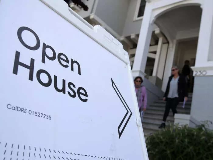 People are flooding open houses and feverishly bidding on homes even after predictions of a market crash and bargain-basement prices. Here's why.