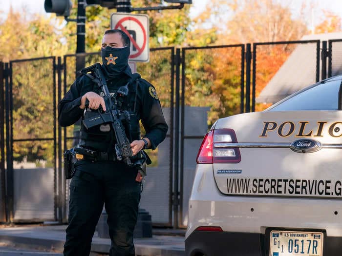 Man with Nazi flag who crashed a U-Haul near the White House has been charged with 'threatening harm to the president'