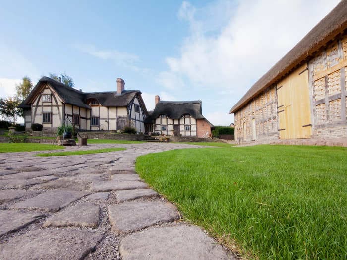 A couple bought a crumbling 700-year-old medieval farmstead and turned it into a fairytale retreat where guests can stay in treehouses overlooking the English countryside