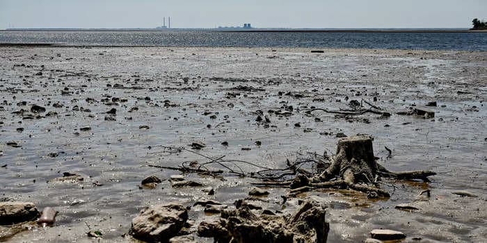 Draining reservoir from Ukraine's destroyed dam is revealing World War II weapons