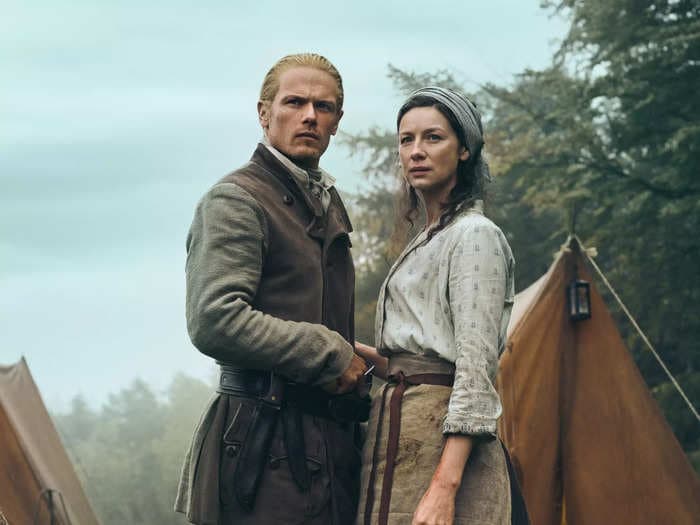 'Outlander' stars Sam Heughan and Caitriona Balfe break down Jamie's 'cold vengeance' in the season 7 premiere, and the Frasers' 'unavoidable' fate