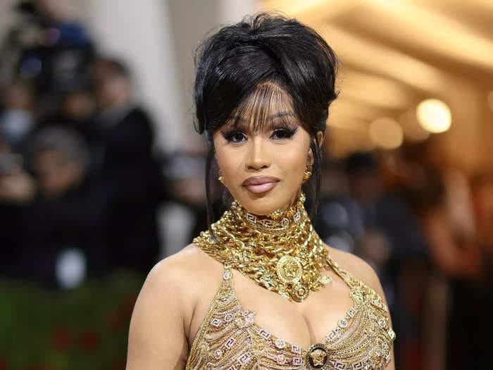 A man who sued Cardi B for $5 million for using his tiger tattoo on her suggestive mix tape cover now owes the rapper $350,000