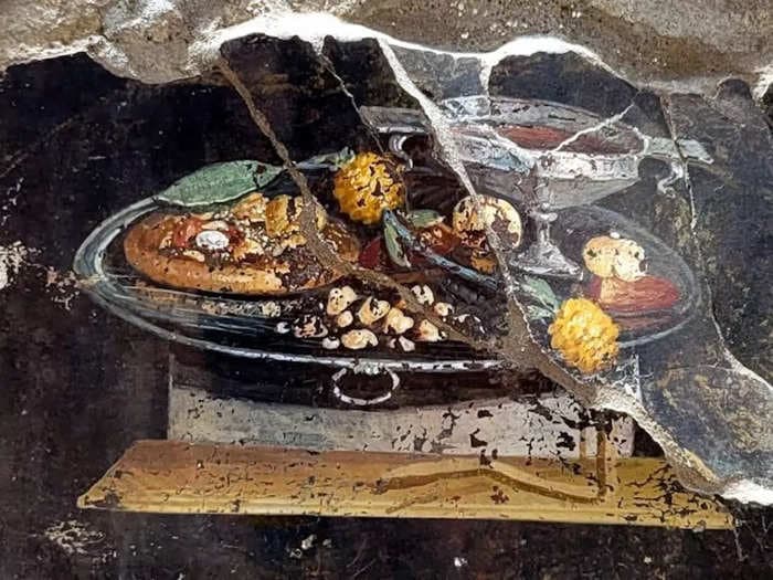 Sorry, pizza purists — a fresco from Pompeii shows Romans were eating a precursor to pizza 2,000 years ago with fruit that resembles pineapple