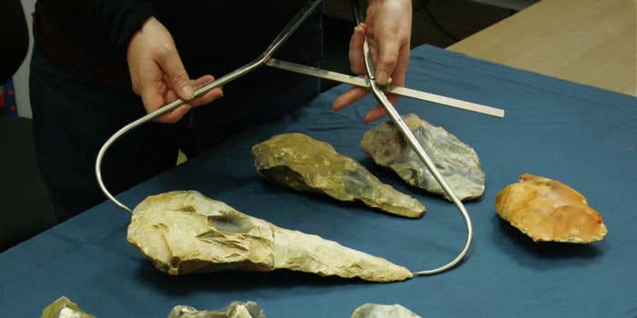 Mysterious giant 300,000-year-old hand axes were found at an Ice Age site in England. Scientists can't work out why they are so big.