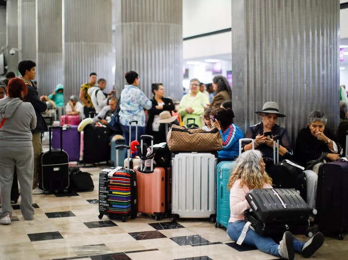 An angry passenger smashed computers at a Mexican airport after an airline couldn't find her booking and wouldn't give her a refund, reports say