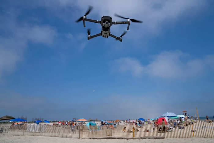 Authorities are using drones to patrol for sharks off the coast of Long Island after a spree of 5 bites in 2 days