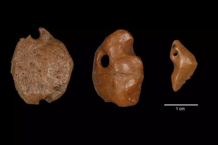 27,000-year-old pendants crafted from the skin of extinct giant sloths could help rewrite the human history of the Americas