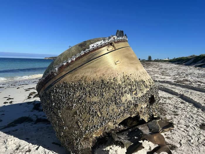 A strange, giant golden cylinder showed up on an Australian beach, and authorities are asking people to stay away from it as they try to figure out what it is