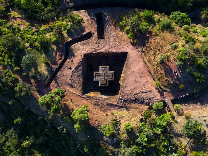 A 13th-century church that was carved from volcanic rock stands inside a deep pit in the earth &mdash; take a closer look