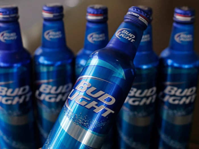 Bud Light owner laid off hundreds of US workers, following months of backlash