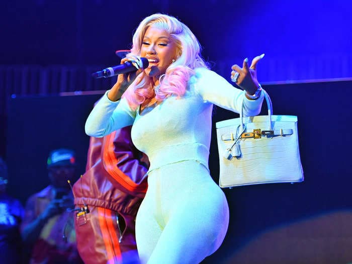 The concertgoer who said Cardi B hit her with a microphone says she wasn't even the person who threw a drink at the rapper: police report