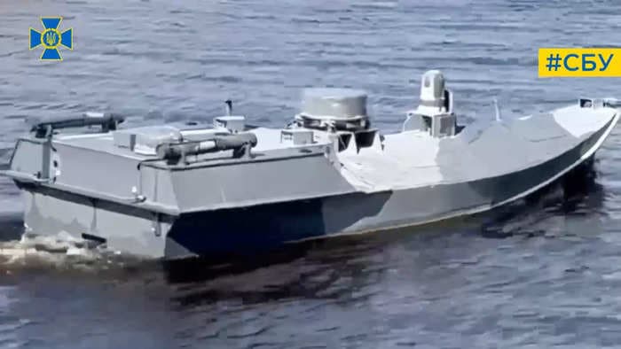 New video shows Russia fail to stop a Ukrainian drone boat named 'Sea Baby' from blowing apart a key bridge with nearly 2,000 lbs of explosives