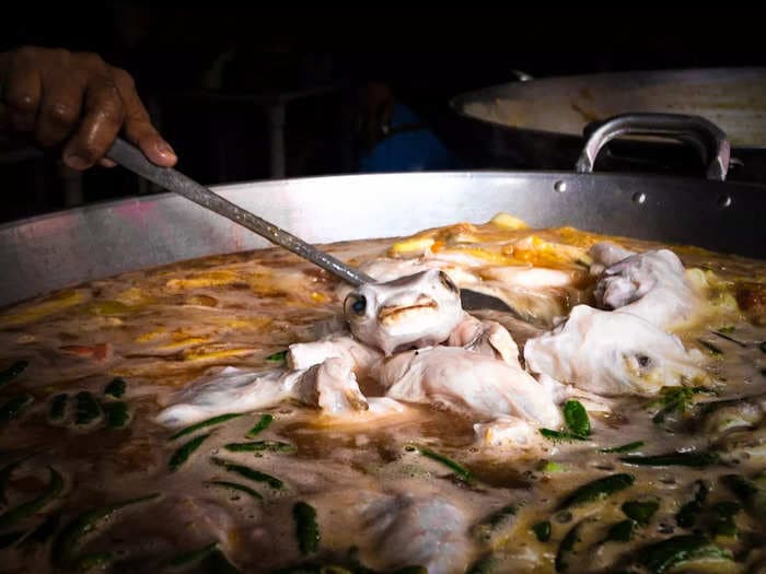 I followed one of the world's most poisonous types of fish from the seafood market to a roadside stall in the Philippines, where it's turned into a $1.80 delicacy that's surprisingly addictive