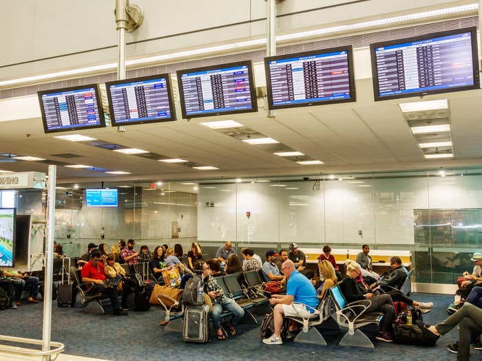 Delayed passengers who challenged each other to races around a Miami airport terminal praised for not turning into an 'angry mob'