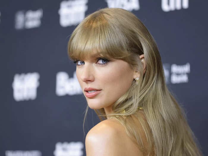 Taylor Swift channeled '1989' wearing an icy-blue corset dress to Jack Antonoff and Margaret Qualley's star-studded wedding