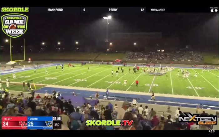 Chaotic broadcast video shows the moment players and fans scramble for safety during a shooting at a high school football game