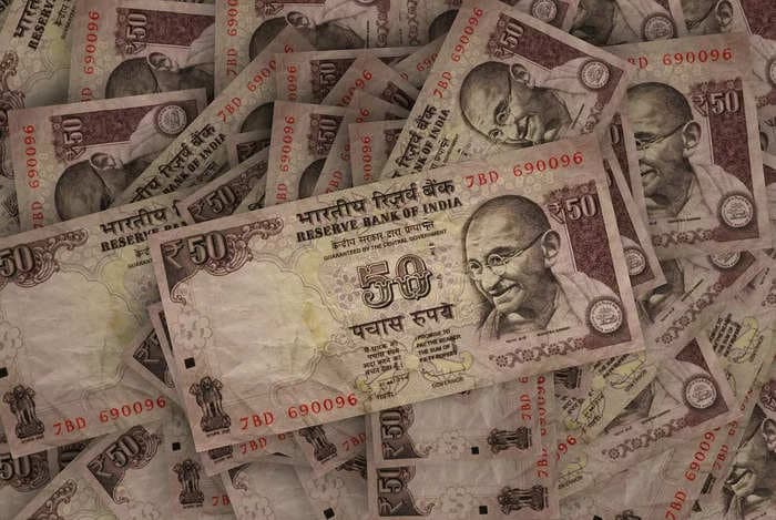 Rupee ends flat as rising crude, strong dollar cap strong gains