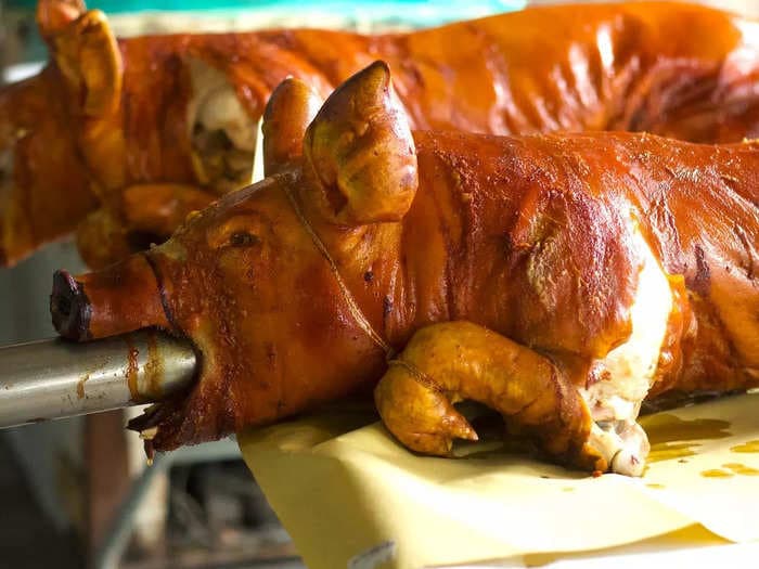 Meet the couple selling 2,200 pounds of spit-roasted pig every week from an artisanal cookhouse in the Philippines