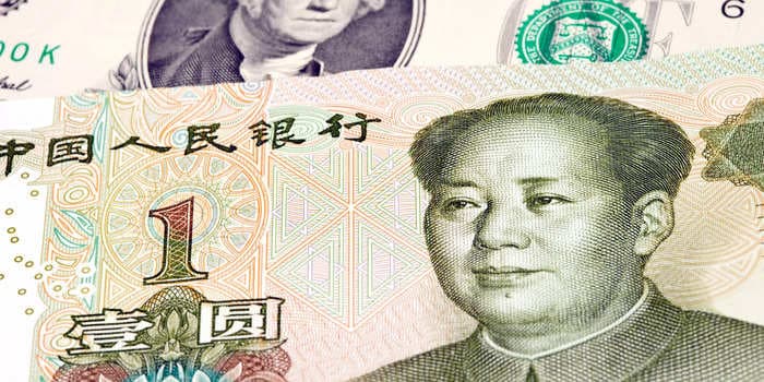 China should sacrifice the yuan to avoid falling into a vicious cycle of debt and deflation, economist says