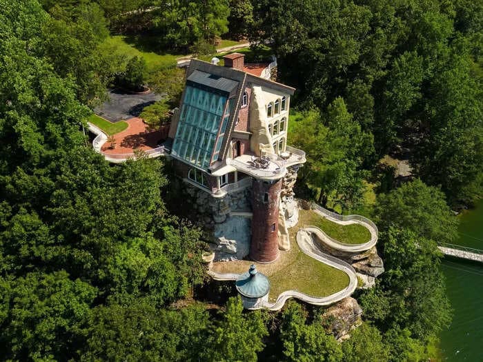 A $4.9 million castle perched on the edge of a cliff in Alabama comes with a 2-story solarium and an 8,000-square-foot garage &mdash; take a look inside