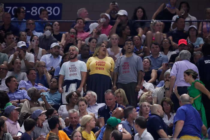 A semifinal match at the US Open got delayed for 50 minutes after a climate protester glued his bare feet to the floor and people had to scrape him off the stands 
