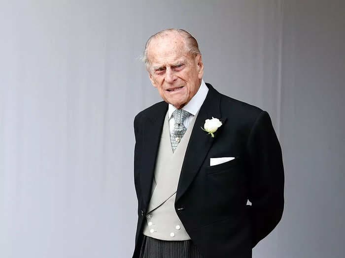 A photographer says he once had to ask Prince Philip to remove 'The Joy of Sex' book from his office