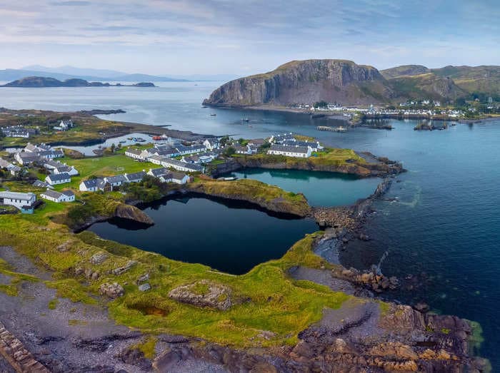 An artist who lives on a tiny Scottish island where people use wheelbarrows instead of cars says there is more freedom and no crime