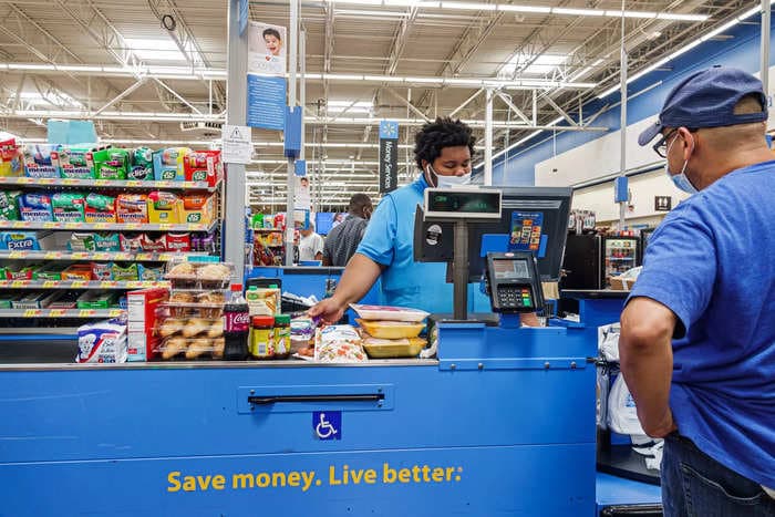 Walmart is stripping some stores of self-checkout lanes and bringing back cashiers