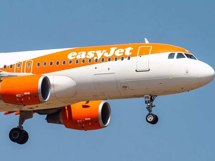 A flight from England to Spain's Canary Islands had to be diverted for police to meet disruptive passengers, easyJet said