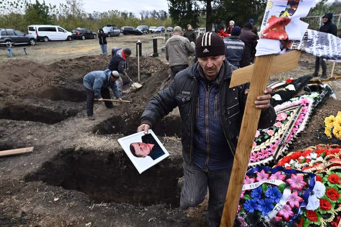 Ukraine accuses 2 brothers of betraying their former neighbors by helping Russia fire a missile on their hometown café killing 59