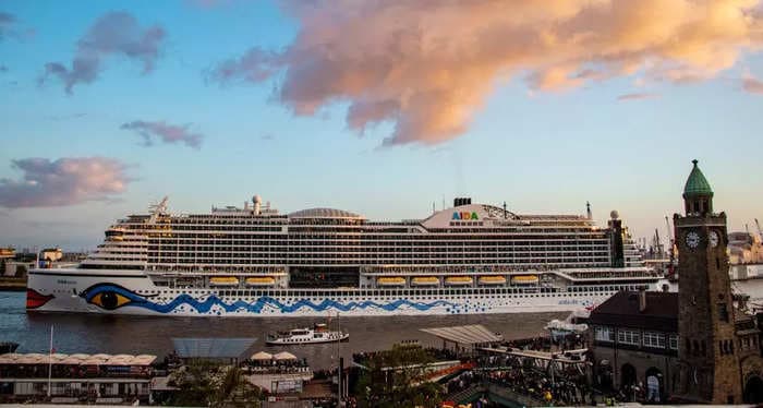 A giant cruise ship that holds thousands of passengers is sailing around the English Channel looking for a crew member who went overboard