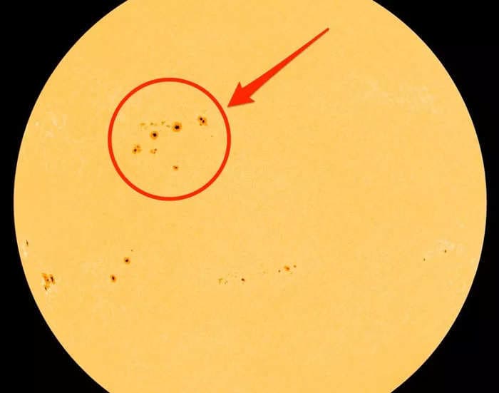 A cluster of sunspots 15 times bigger than Earth could send a solar storm our way as early as Saturday