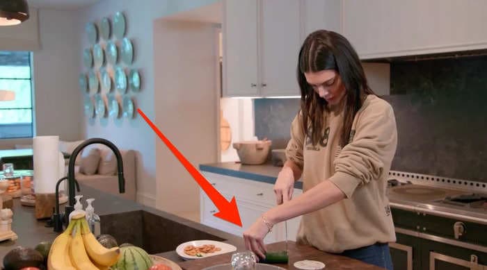 Kylie Jenner teases sister Kendall as she chops an onion, referencing the model's cucumber-cutting faux pas last year   