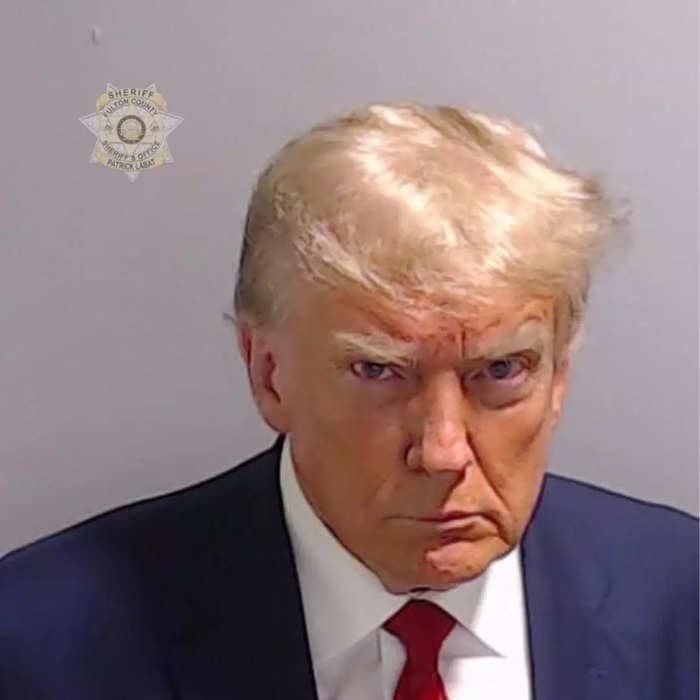 Donald Trump says he'll sell you a piece of the 'priceless' suit he wore in his mugshot — but make sure to read the fine print