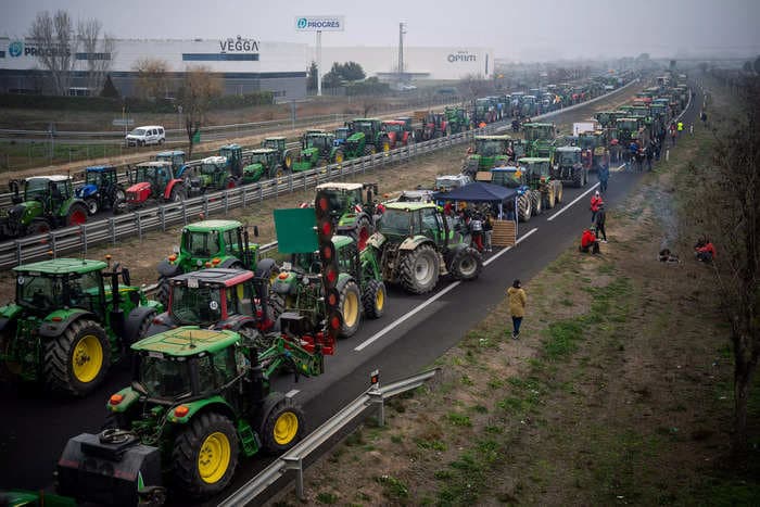 Angry European farmers are blocking freeways with tractors and spraying manure on buildings over green push