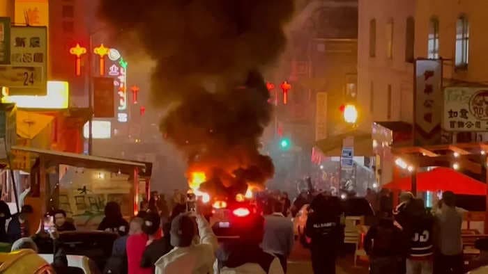 A crowd set fire to a Waymo taxi in San Francisco, as tensions about driverless tech grow