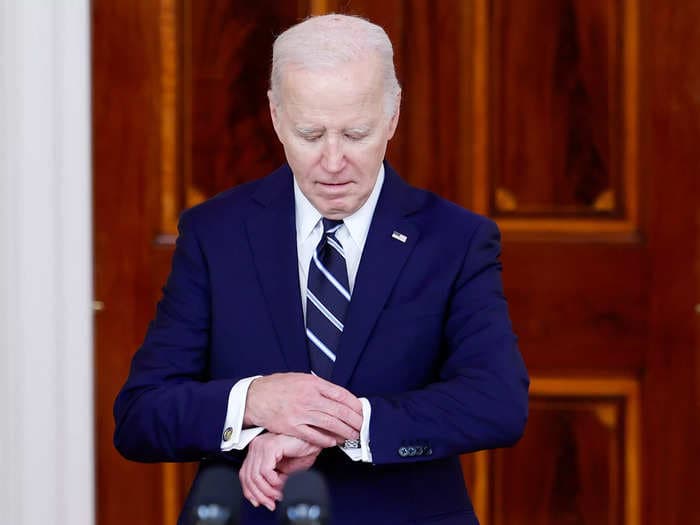 Americans are growing more optimistic about the economy &mdash; but it's not helping President Biden just yet