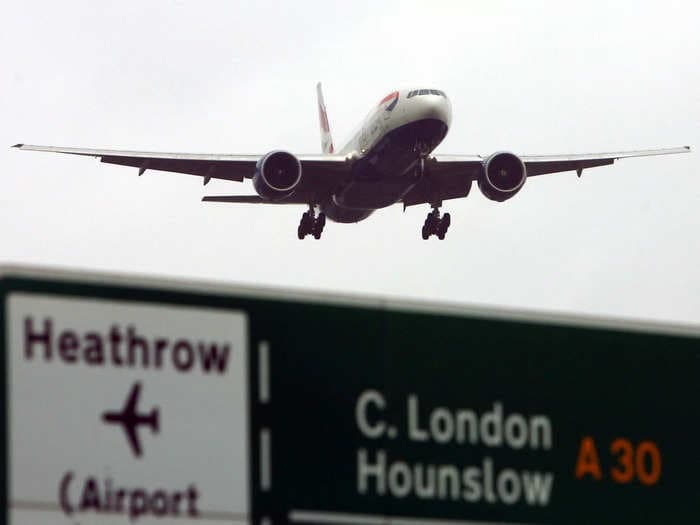 A baggage handler at a London airport is in critical condition after being dragged by a conveyor belt, report says