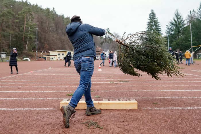 A woman lost her $823,000 injury claim after lawyers found a photo of her winning a Christmas-tree-throwing competition