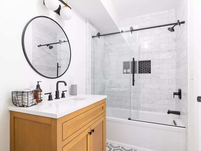 10 tricks to make your bathroom look and feel bigger, according to interior designers