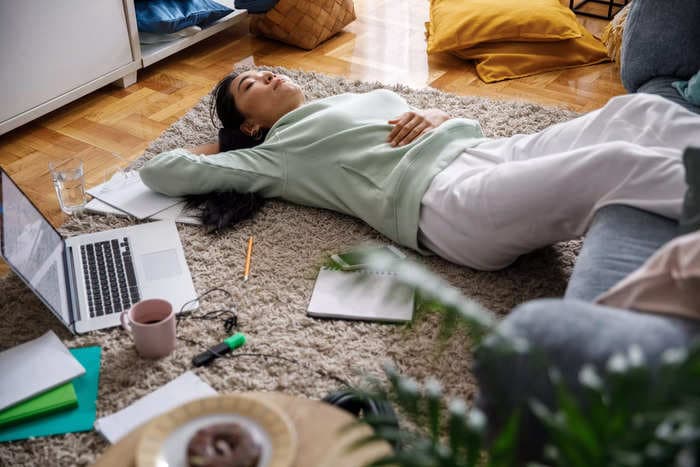 Lying on the floor can help you feel less overwhelmed. Here's how to do it and why it works.