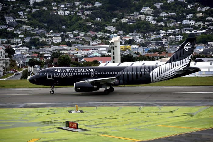 A crew member hit the ceiling and a passenger was scalded by spilled coffee as turbulence caused 'pandemonium' on a flight in New Zealand