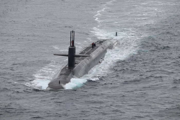 US Navy nuclear ballistic missile submarine surfaces off Norway in unusual flex as 'Doomsday' plane flies overhead