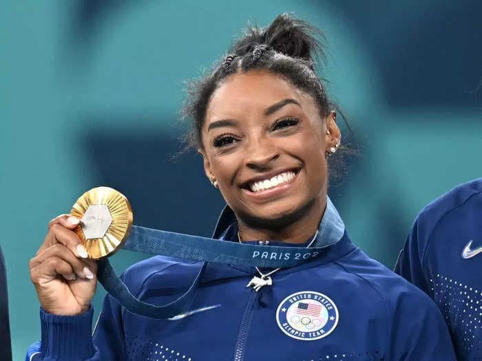 Simone Biles wore a goat necklace encrusted with 546 diamonds while accepting her gold medal at the Paris Olympics