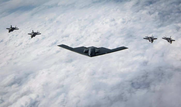 Photos show a US Air Force B-2 Spirit bomber flying with Japanese F-35s for the first time