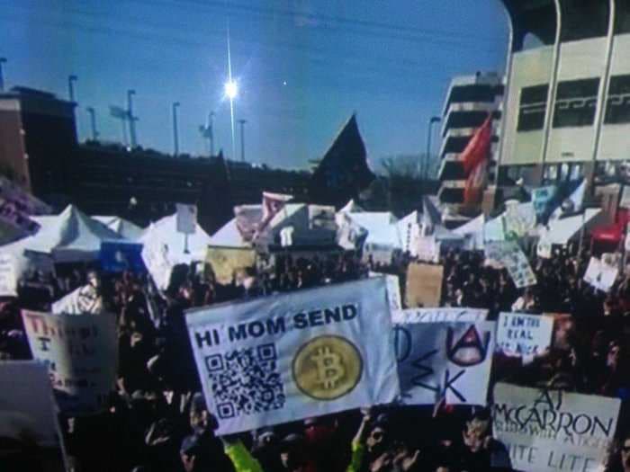 Some College Kid Made Over $24,000 Yesterday Just By Waving This Bitcoin Sign On ESPN