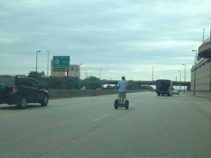 Here's A Guy Riding A Segway In The Middle Of Traffic On Chicago's Busiest Freeway