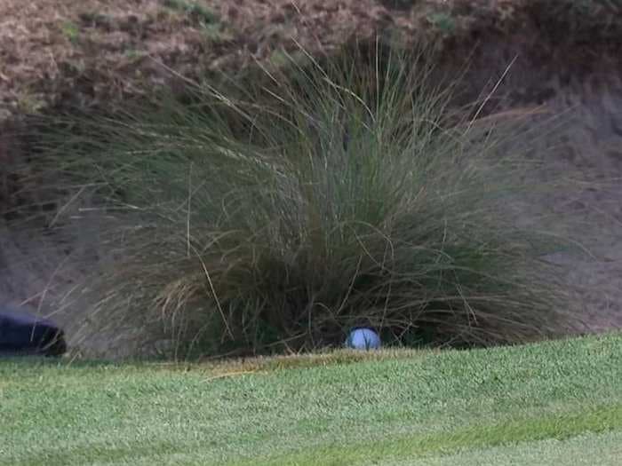 Golfer Converts One Of The Best Pars You'll Ever See After His Ball Gets Jammed Under A Clump Of Grass