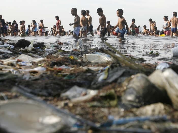 These Disturbing Photos Of Children Playing In Garbage Show Just How Disgustingly Polluted The Earth Is