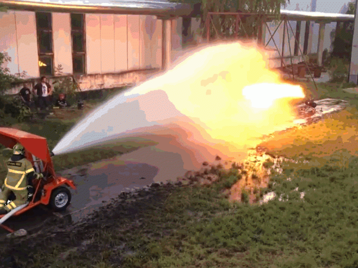 Flamethrower meets firehose in the ultimate battle of fire and water